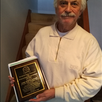 Ken Wettlaufer with his Volunteer Recognition Award (2018)